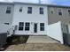Exterior patio space with white fencing and access door at 231 Paramount Dr, Smithfield, NC 27577