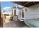 Back porch featuring a door into the house and a small bay window at 2312 Buckstone Ct, Fuquay Varina, NC 27526