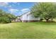 Spacious backyard with lush green grass and back porch at 2312 Buckstone Ct, Fuquay Varina, NC 27526