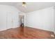 Bedroom with hardwood floors and a view into the house at 2312 Buckstone Ct, Fuquay Varina, NC 27526