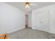 Bedroom with carpeted floors and view of a double closet at 2312 Buckstone Ct, Fuquay Varina, NC 27526