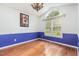 Sunny dining room featuring hardwood floors, decorative lighting and large window at 2312 Buckstone Ct, Fuquay Varina, NC 27526