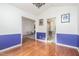 Dining room showcasing wood floors, blue wainscoting, white walls and two openings at 2312 Buckstone Ct, Fuquay Varina, NC 27526