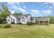 Charming single-Gathering home with a well-manicured lawn and a detached carport offering convenient parking at 2312 Buckstone Ct, Fuquay Varina, NC 27526