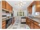 Well-appointed kitchen with lots of counter space and eat-in breakfast nook filled with natural light at 2312 Buckstone Ct, Fuquay Varina, NC 27526