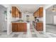 Functional kitchen with light countertops, ceiling fan, and ample cabinet space offering storage and convenience at 2312 Buckstone Ct, Fuquay Varina, NC 27526