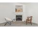 A fireplace flanked by comfortable seating creates a warm and inviting atmosphere in the living room at 2312 Buckstone Ct, Fuquay Varina, NC 27526