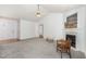 Comfortable living space featuring a fireplace and open layout, ideal for both relaxation and entertainment at 2312 Buckstone Ct, Fuquay Varina, NC 27526