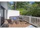 This outdoor area features a back deck with comfortable wicker seating at 2409 Basil Dr, Raleigh, NC 27612