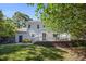 This home boasts a manicured lawn, mature trees and a raised deck off the back of the house at 2409 Basil Dr, Raleigh, NC 27612
