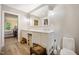 Bathroom with double sink vanity, framed mirror, and wood-look tile flooring at 2409 Basil Dr, Raleigh, NC 27612
