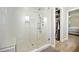 Walk-in shower with glass door features white subway tile and a built-in bench at 2409 Basil Dr, Raleigh, NC 27612