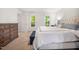 Neutral bedroom features a bed with a cushioned headboard, and a beautiful view at 2409 Basil Dr, Raleigh, NC 27612