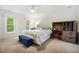 Bedroom features neutral carpet, a cushioned headboard, and a solid wood desk at 2409 Basil Dr, Raleigh, NC 27612