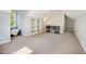 This bonus room offers a window, built-in shelving and an additional seating area at 2409 Basil Dr, Raleigh, NC 27612