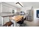 This eat-in kitchen features white cabinets, stainless steel appliances, and a butcher block island at 2409 Basil Dr, Raleigh, NC 27612
