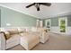 Comfortable living room featuring neutral carpet and paint and ceiling fan at 2409 Basil Dr, Raleigh, NC 27612