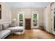 Comfortable living room with hardwood floors and ample natural light at 2409 Basil Dr, Raleigh, NC 27612