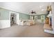 Spacious living room with fireplace and neutral carpet and paint at 2409 Basil Dr, Raleigh, NC 27612