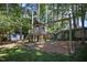 This property features a wooden playground in the fenced backyard at 2409 Basil Dr, Raleigh, NC 27612