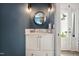 Charming powder room featuring updated vanity and fixtures at 2409 Basil Dr, Raleigh, NC 27612