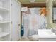 Bathroom with white sink and floral shower curtain with white built in storage cabinet at 256 Marilyn Cir, Cary, NC 27513