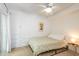 Cozy bedroom featuring a ceiling fan, built-in closet with drawers, and a slider to the outside at 256 Marilyn Cir, Cary, NC 27513