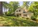 Backyard view of home with a balcony and lush, green surroundings at 256 Marilyn Cir, Cary, NC 27513
