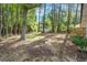 Overlooking a wooded backyard of mature trees, this is a tranquil retreat surrounded by nature at 2609 Elmhurst Cir, Raleigh, NC 27610