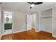 Bedroom boasts hardwood floors, ceiling fan and access to an ensuite bathroom at 2609 Elmhurst Cir, Raleigh, NC 27610
