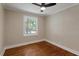 Bedroom featuring hardwood floors, a window, and neutral walls at 2609 Elmhurst Cir, Raleigh, NC 27610