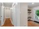 Hallway features access to back door, laundry, and wood floors at 2609 Elmhurst Cir, Raleigh, NC 27610