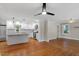 Modern kitchen featuring white cabinetry, stainless steel appliances, and hardwood floors at 2609 Elmhurst Cir, Raleigh, NC 27610