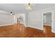Open-concept living room featuring hardwood floors and neutral paint at 2609 Elmhurst Cir, Raleigh, NC 27610