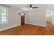 Bright living room featuring hardwood floors and a modern ceiling fan at 2609 Elmhurst Cir, Raleigh, NC 27610