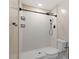 Bright bathroom with a walk-in shower featuring white subway tile and black fixtures at 2609 Elmhurst Cir, Raleigh, NC 27610