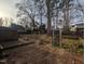 Backyard features deck, mature trees, shed, and swing set at 2705 Royster St, Raleigh, NC 27608