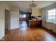 Dining room with hardwood floors, chandelier, and a view into the kitchen at 2705 Royster St, Raleigh, NC 27608