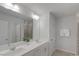 Bright bathroom with double vanity, modern fixtures, and a glass-enclosed shower, offering a spa-like experience at 273 Millennium Dr, Pittsboro, NC 27312