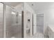 Modern bathroom featuring a sleek glass-enclosed shower and a spacious vanity with contemporary finishes at 273 Millennium Dr, Pittsboro, NC 27312