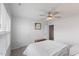 Bright bedroom featuring a ceiling fan, natural light, and neutral decor at 273 Millennium Dr, Pittsboro, NC 27312