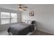 Comfortable bedroom with a ceiling fan, natural light, and neutral decor at 273 Millennium Dr, Pittsboro, NC 27312