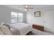Bright bedroom with a ceiling fan, natural light, and neutral color scheme at 273 Millennium Dr, Pittsboro, NC 27312
