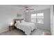 Bright bedroom featuring a ceiling fan, natural light, and neutral decor at 273 Millennium Dr, Pittsboro, NC 27312