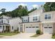 Inviting two-story townhouse with a two-car garage and manicured lawn at 273 Millennium Dr, Pittsboro, NC 27312
