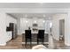 Contemporary kitchen with white cabinets, quartz countertops, stainless steel appliances, and pendant lights at 273 Millennium Dr, Pittsboro, NC 27312