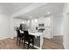 Elegant kitchen with white cabinetry, stainless appliances, and a center island with seating at 273 Millennium Dr, Pittsboro, NC 27312