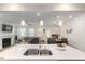 A kitchen featuring stainless steel dual sink, pendant lights over island, and open to living and dining areas at 273 Millennium Dr, Pittsboro, NC 27312