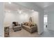 Cozy living room with neutral carpet, a comfortable sofa, and a reading nook, perfect for relaxation at 273 Millennium Dr, Pittsboro, NC 27312