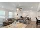Spacious living room flows to the dining area, featuring neutral decor and comfortable seating arrangements at 273 Millennium Dr, Pittsboro, NC 27312